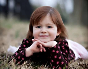 Smiling girl in grass